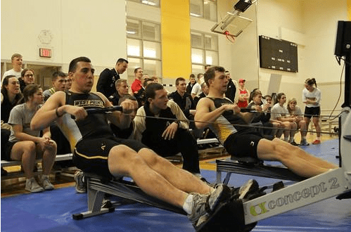 Group of people working out with rowing machines
